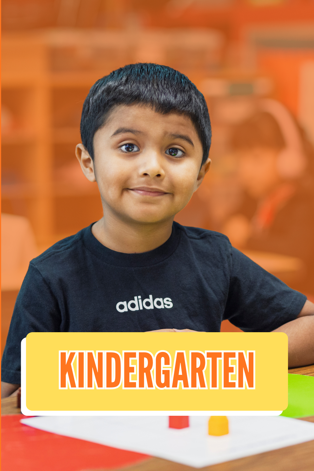 Kinder student smiling at the camera